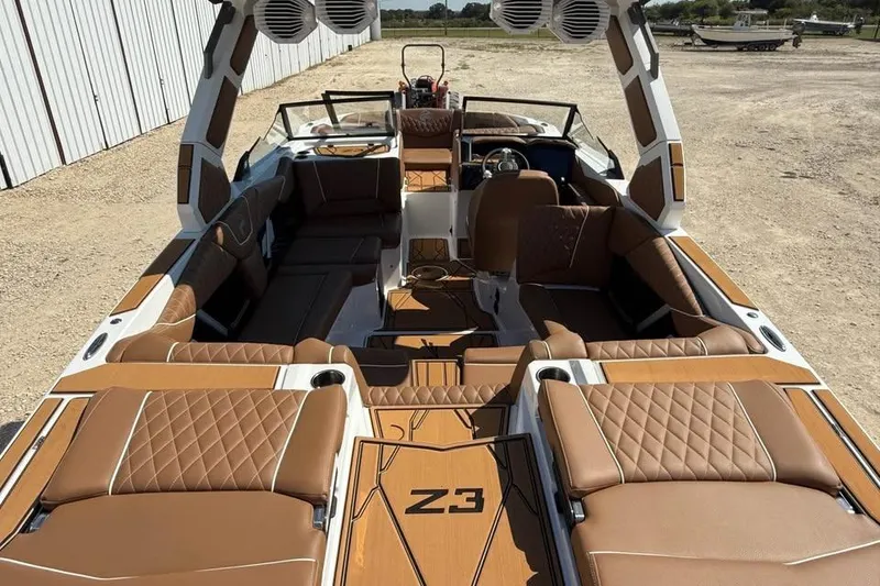 Slide: The Image of 2026 Tigé Z3 boat interior with luxurious brown leather seating and modern design. - 6