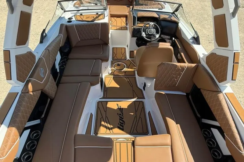 Slide: The Image of 2026 Tigé Z3 boat interior with luxurious brown seating and modern dashboard design. - 7