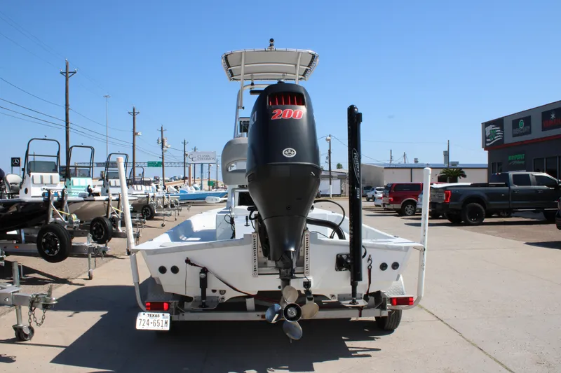 Slide: The Image of 2020 Shoalwater 21 Catamaran with 200 HP engine on trailer in dealership lot. - 13