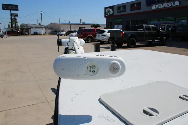 Slide: The Image of 2020 Shoalwater 21 Catamaran with Minn Kota Riptide motor in a parking lot. - 16
