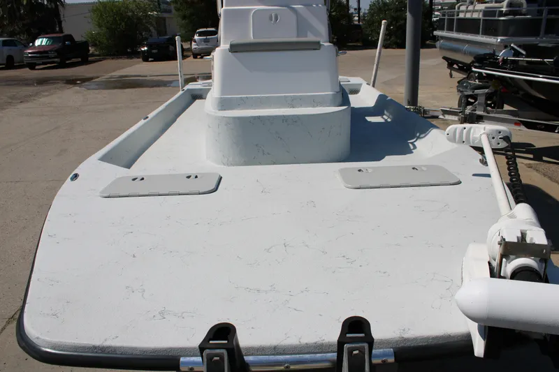 Slide: The Image of 2020 Shoalwater 21 Catamaran boat deck with trolling motor in a parking lot. - 17