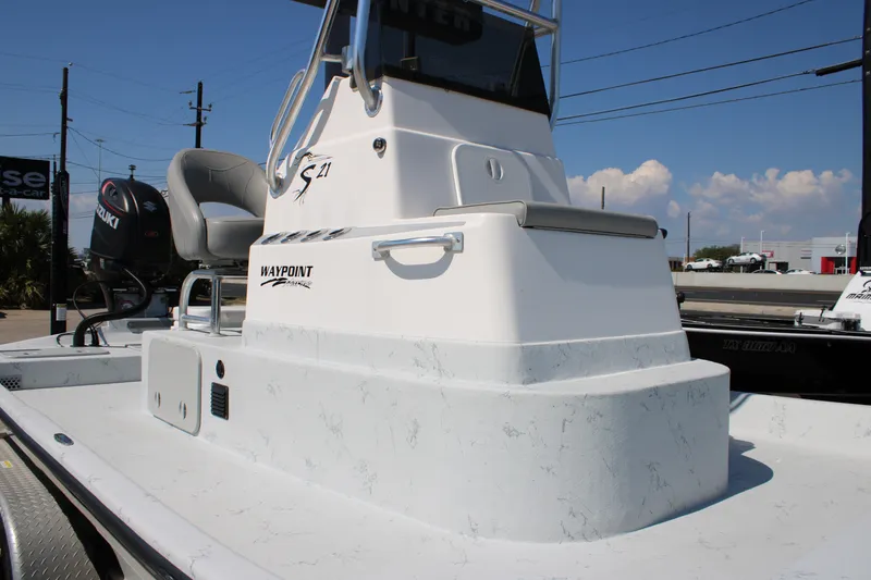 Slide: The Image of 2020 Shoalwater 21 Catamaran boat with Suzuki engine, featuring a sleek white design. - 18