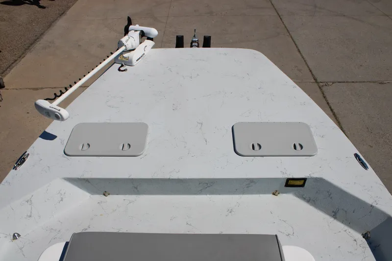 Slide: The Image of 2020 Shoalwater 21 Catamaran deck with trolling motor and storage hatches. - 5