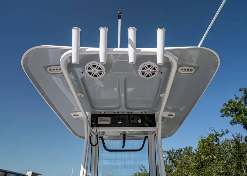 Slide: The Image of 2026 Sea Hunt Ultra 245 SE boat roof with rod holders and speakers. - 11