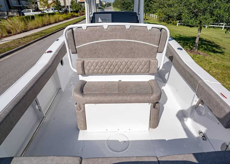 Slide: The Image of 2026 Sea Hunt Ultra 245 SE boat interior with cushioned seating and modern design. - 12