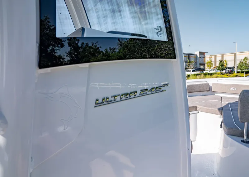 Slide: The Image of 2026 Sea Hunt Ultra 245 SE boat with sleek design and comfortable seating. - 16