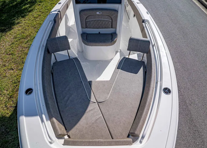 Slide: The Image of 2026 Sea Hunt Ultra 245 SE boat interior with cushioned seating and sleek design. - 20