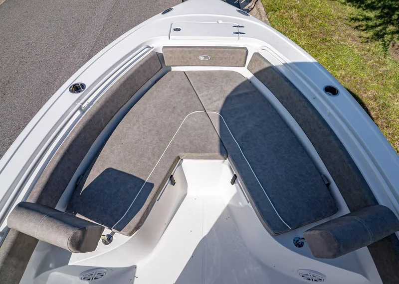 Slide: The Image of 2026 Sea Hunt Ultra 245 SE boat interior with cushioned seating and sleek design. - 22