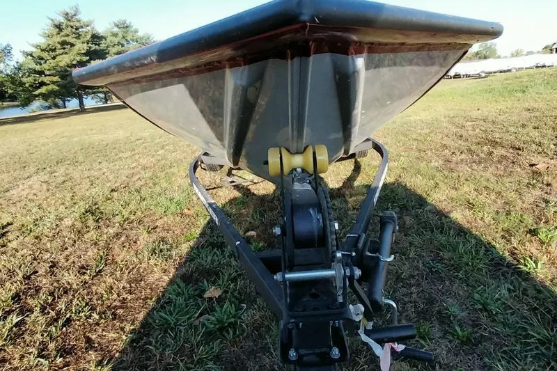 Slide: The Image of 2024 Tracker Pro Team 175 TXW boat on trailer, grassy area, sunny day. - 12