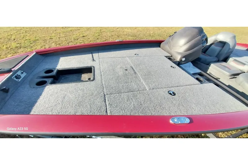 Slide: The Image of 2024 Tracker Pro Team 175 TXW boat deck with storage compartments and seating. - 19