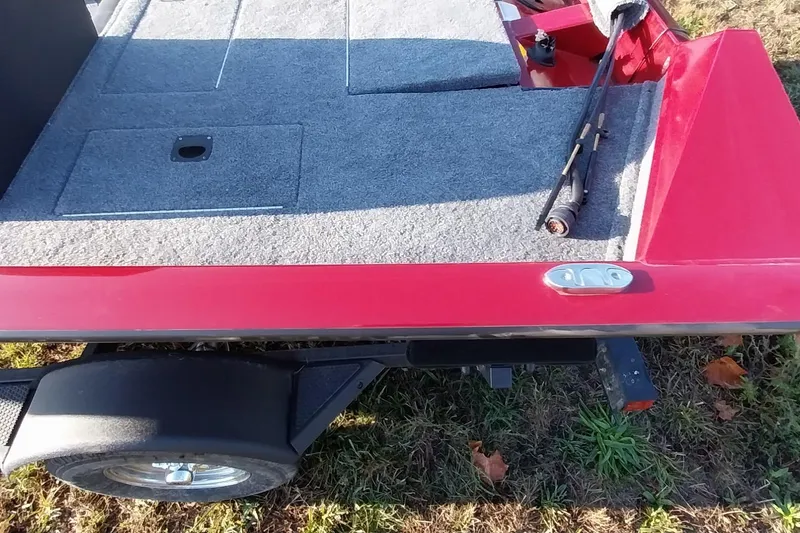 Slide: The Image of 2024 Tracker Pro Team 175 TXW boat deck with fishing rod, red exterior. - 26