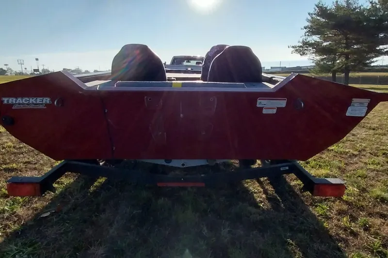 Slide: The Image of 2024 Tracker Pro Team 175 TXW boat on grassy field, rear view. - 31