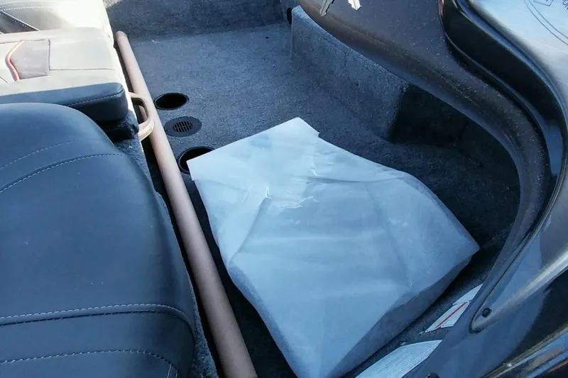 Slide: The Image of 2024 Tracker Pro Team 175 TXW interior with seat and storage area. - 4