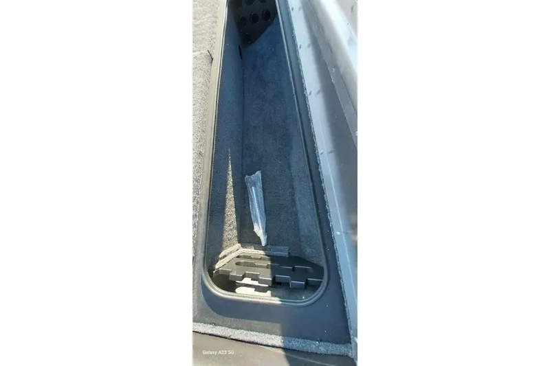 Slide: The Image of 2024 Tracker Pro Team 175 TXW boat interior storage compartment. - 7