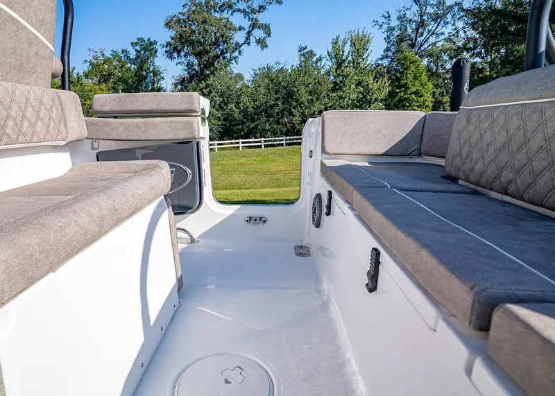 Slide: The Image of Interior view of 2026 Sea Hunt Ultra 255 SE boat with cushioned seating. - 10