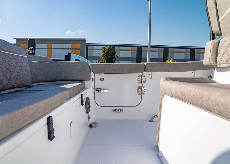 Slide: The Image of Interior view of 2026 Sea Hunt Ultra 255 SE boat with cushioned seating. - 12