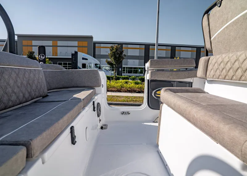Slide: The Image of 2026 Sea Hunt Ultra 255 SE boat interior with cushioned seating and modern design. - 13