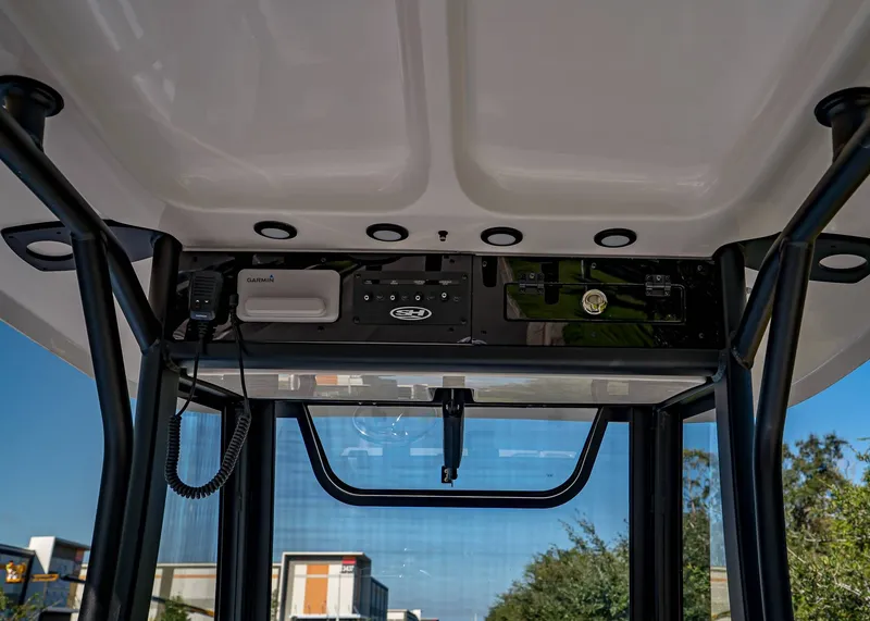 Slide: The Image of 2026 Sea Hunt Ultra 255 SE boat console with Garmin electronics and modern design. - 17