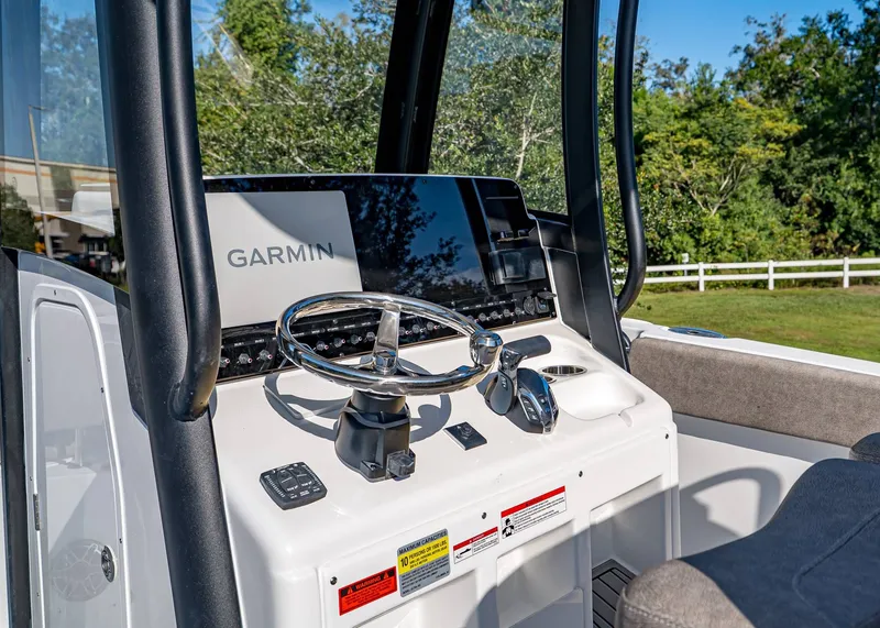 Slide: The Image of 2026 Sea Hunt Ultra 255 SE boat console with Garmin navigation system. - 19