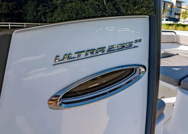 Slide: The Image of 2026 Sea Hunt Ultra 255 SE boat detail with logo and sleek design. - 22
