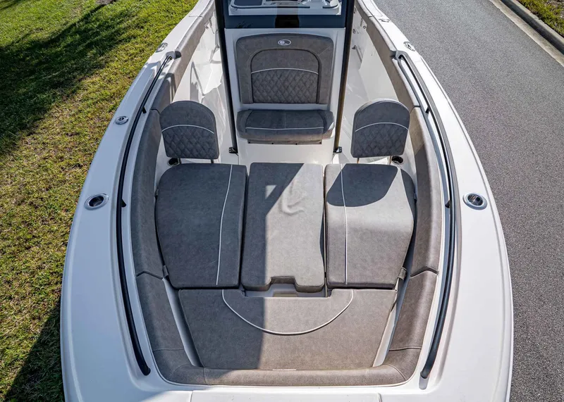 Slide: The Image of 2026 Sea Hunt Ultra 255 SE boat interior with cushioned seating and sleek design. - 24