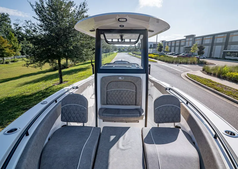 Slide: The Image of 2026 Sea Hunt Ultra 255 SE boat interior with cushioned seating and modern design. - 25