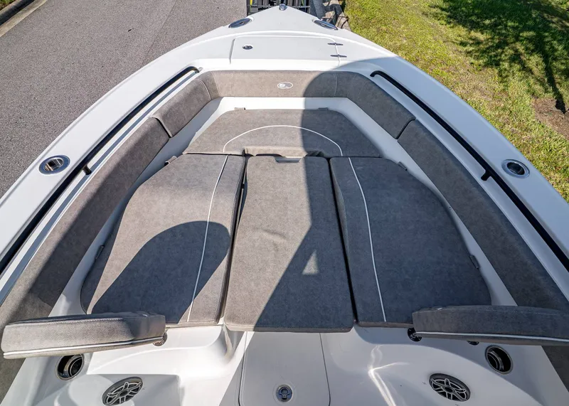 Slide: The Image of 2026 Sea Hunt Ultra 255 SE boat with spacious cushioned seating area. - 27