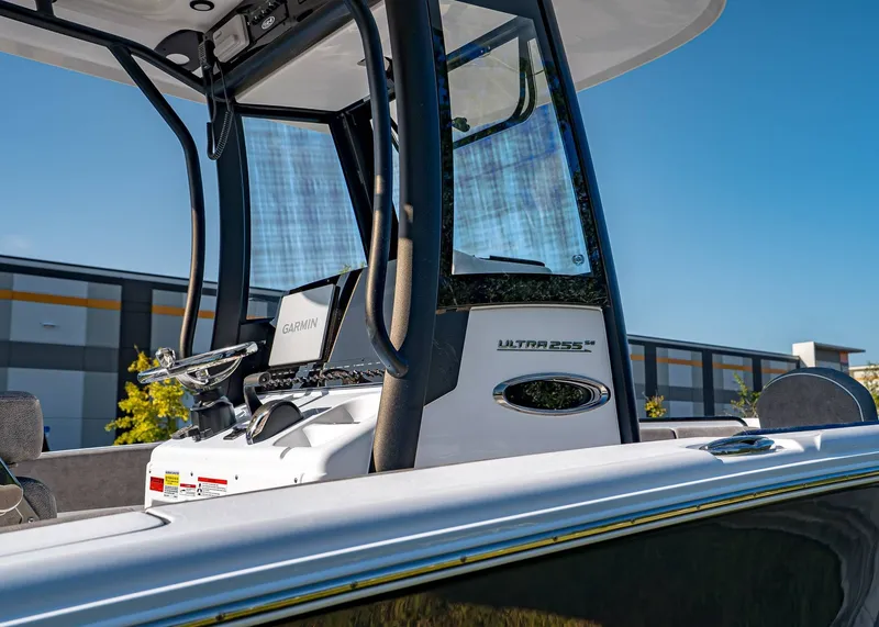 Slide: The Image of 2026 Sea Hunt Ultra 255 SE boat console with Garmin equipment, against a clear blue sky. - 5
