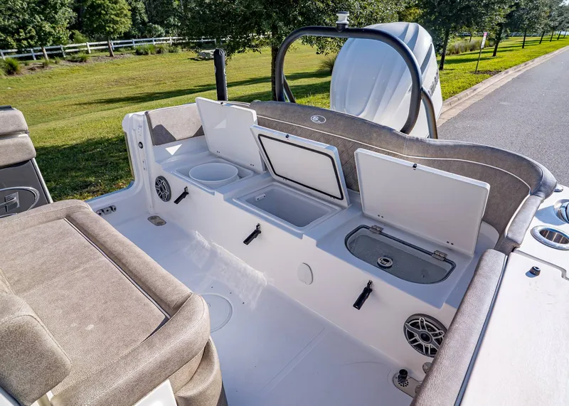 Slide: The Image of 2026 Sea Hunt Ultra 255 SE boat interior with open storage compartments and seating. - 7