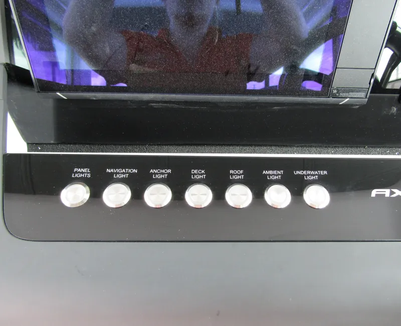 Slide: The Image of Control panel of 2024 Axopar 37XC CROSS CABIN with various light switches. - 18