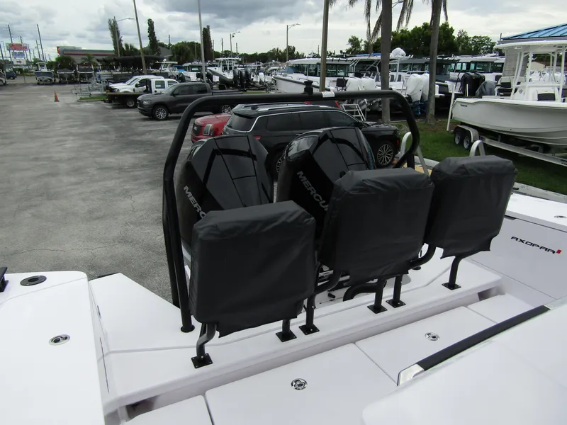 Slide: The Image of 2024 Axopar 37XC CROSS CABIN with Mercury engines at a marina. - 34