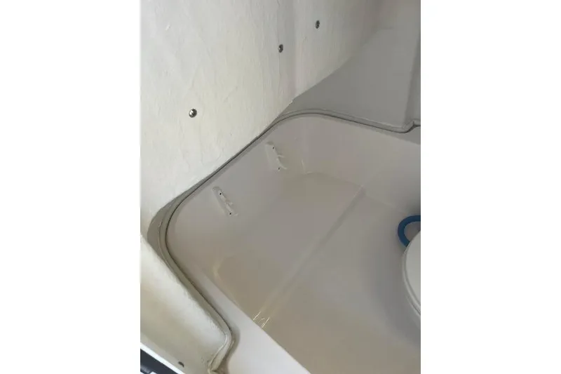 Slide: The Image of Interior view of 2023 Sea Fox 228 Commander boat, featuring a clean, white compartment. - 15