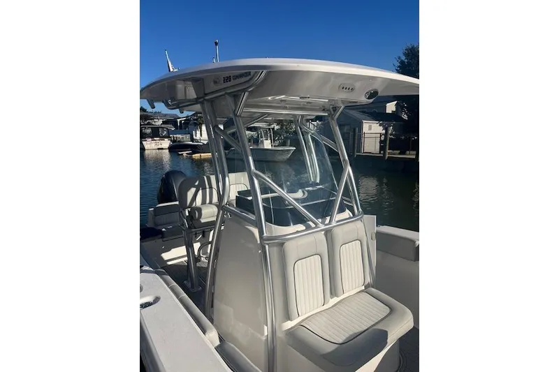 Slide: The Image of 2023 Sea Fox 228 Commander boat docked, featuring sleek design and comfortable seating. - 24