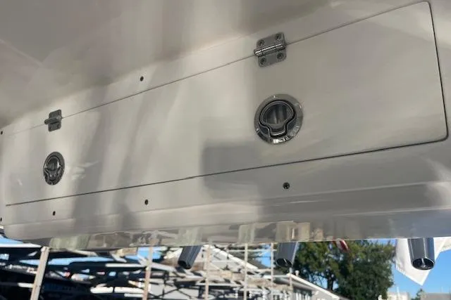 Slide: The Image of 2023 Sea Fox 228 Commander boat storage compartment with latches and hinges. - 3