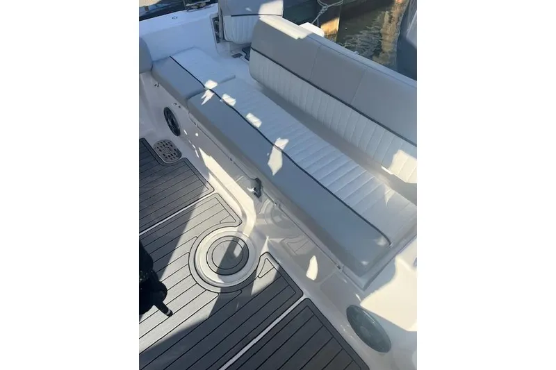 Slide: The Image of 2023 Sea Fox 228 Commander boat interior with cushioned seating and sleek flooring. - 31