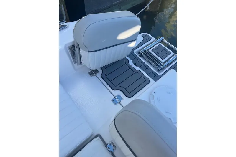 Slide: The Image of 2023 Sea Fox 228 Commander boat interior with cushioned seating and deck details. - 33