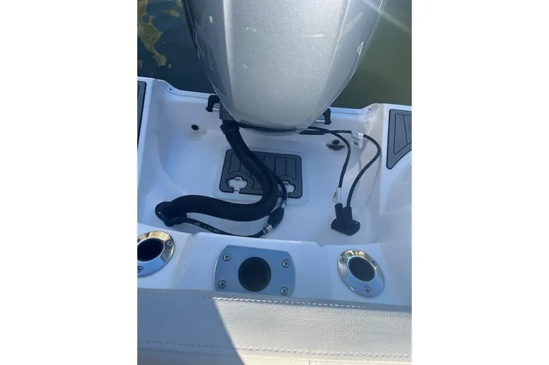 Slide: The Image of 2023 Sea Fox 228 Commander boat engine area with cables and fittings. - 34