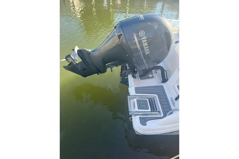 Slide: The Image of 2023 Sea Fox 228 Commander with Yamaha outboard motor on calm water. - 4