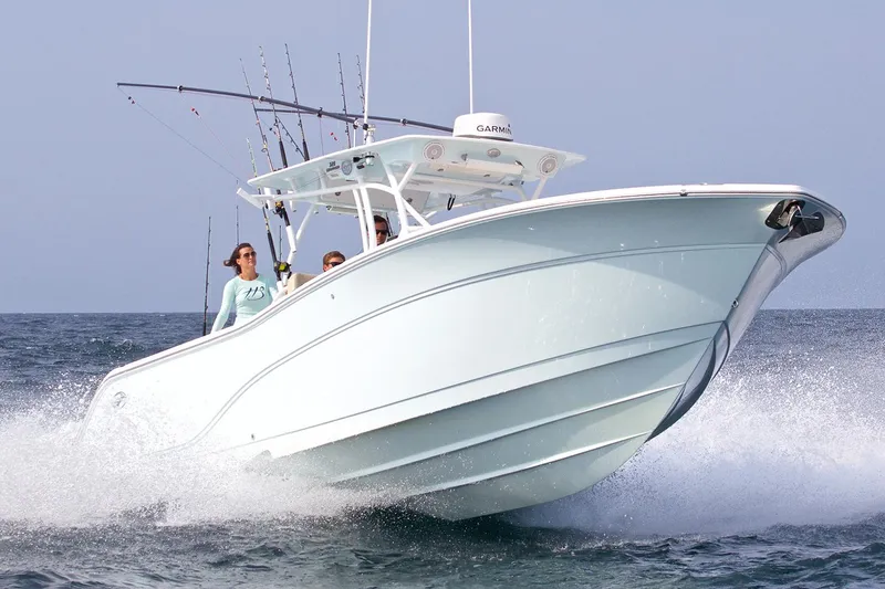 The Image of 2017 Sea Fox 328 Commander boat with dual Yamaha engines in a warehouse. - 0