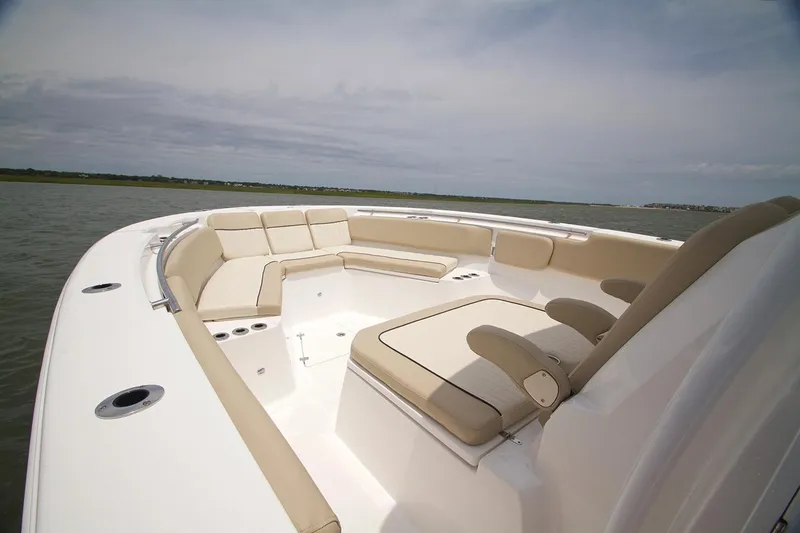 Slide: The Image of 2017 Sea Fox 328 Commander boat interior with seating and dual engines. - 15