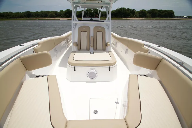 Slide: The Image of 2017 Sea Fox 328 Commander boat interior with beige seating and steering wheel. - 16