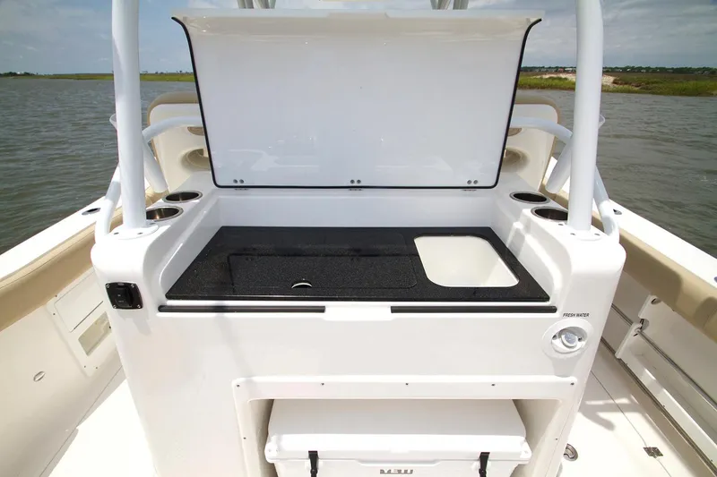 Slide: The Image of Luxurious seating on 2017 Sea Fox 328 Commander boat, featuring plush beige upholstery. - 19