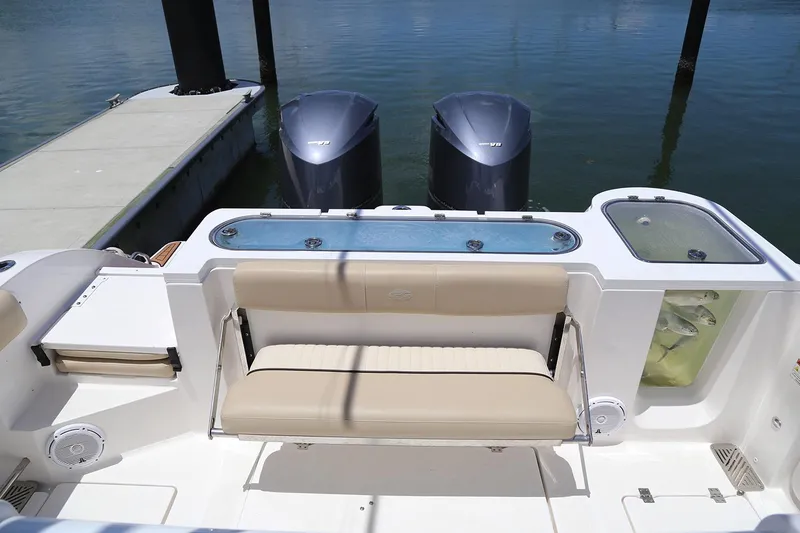 Slide: The Image of 2017 Sea Fox 328 Commander boat interior with tan seating and cup holders. - 20