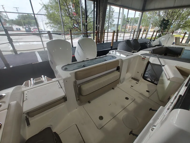 Slide: The Image of 2017 Sea Fox 328 Commander interior with teak steps and beige seating. - 27