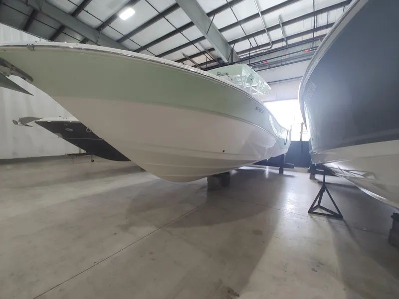Slide: The Image of 2017 Sea Fox 328 Commander boat on a trailer under a clear blue sky. - 3