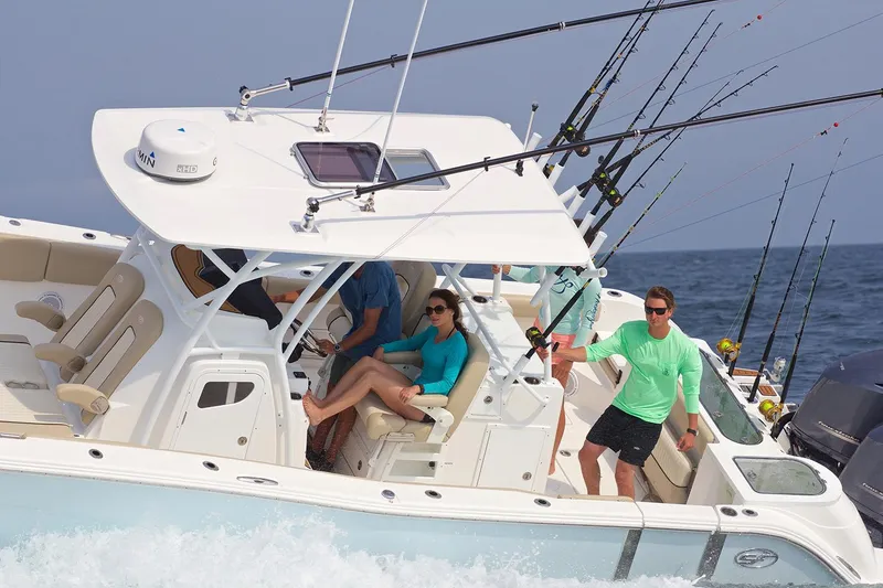 Slide: The Image of 2017 Sea Fox 328 Commander dashboard with Garmin navigation displays and controls. - 4