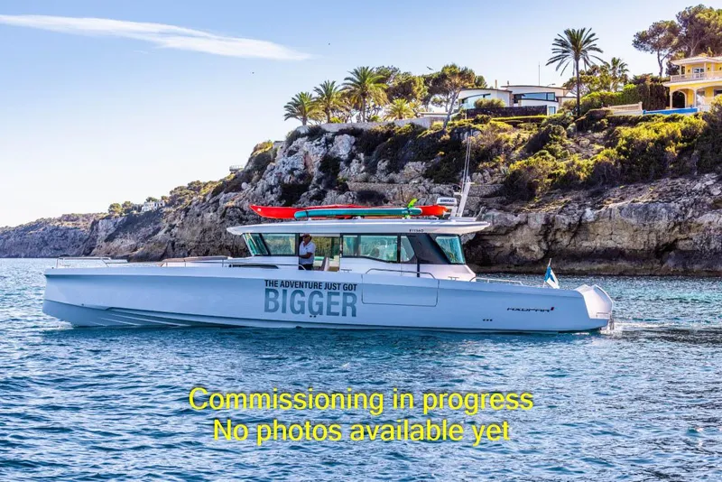 Slide: The Image of 2024 Axopar 45 XC Cross Cabin BRABUS Trim boat on scenic coastal waters. - 4