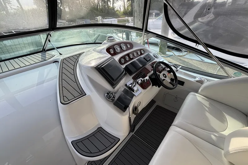 Slide: The Image of Interior of 1998 Silverton 360 Express yacht with white seating and panoramic windows. - 11