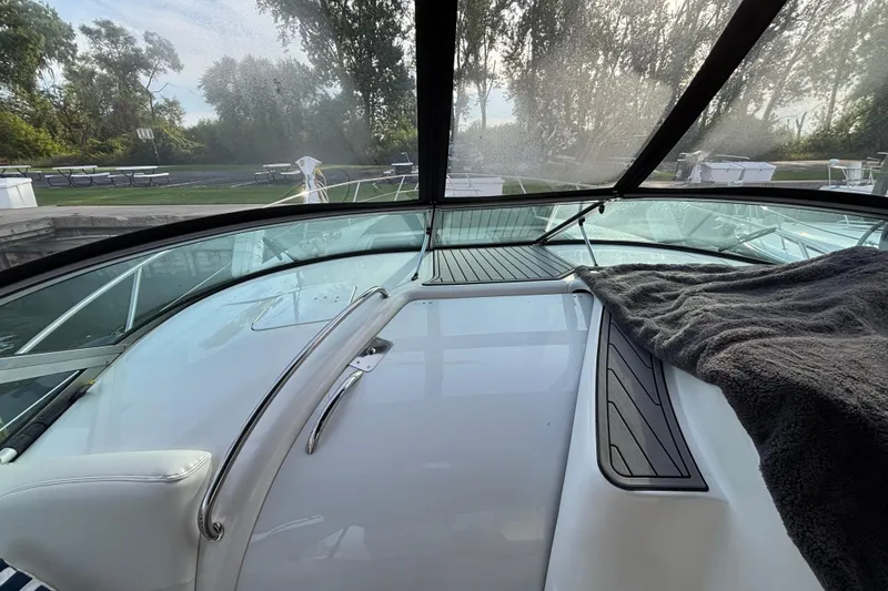 Slide: The Image of Control panel of a 1998 Silverton 360 Express boat with radio and throttle levers. - 15