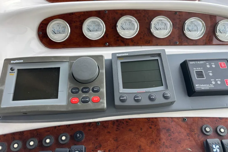 Slide: The Image of 1998 Silverton 360 Express yacht interior with cozy seating and nautical decor. - 18